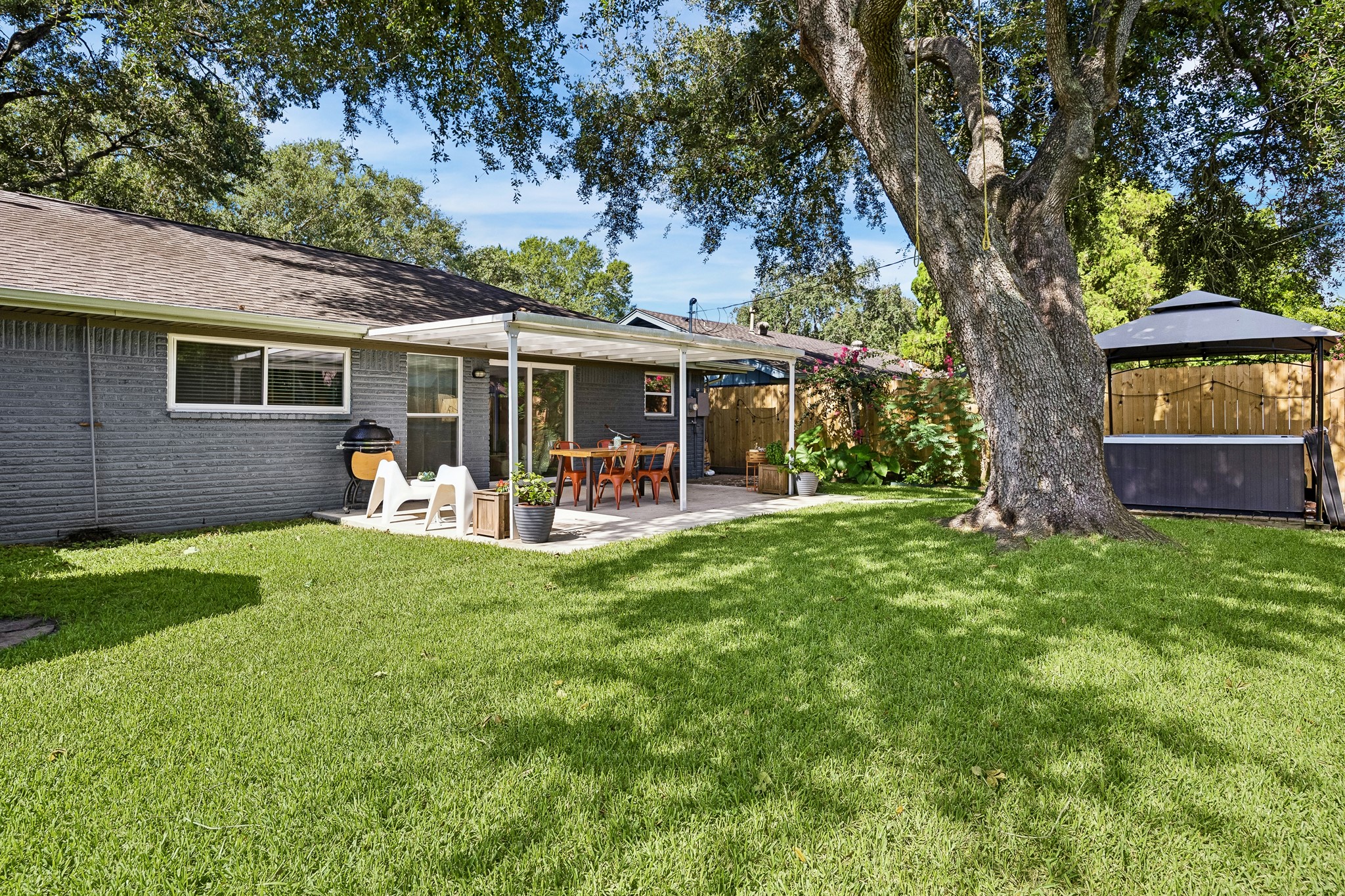 4514 Warm Springs Road Houston, TX 77035 - Photo 29 of 31 The lush lawn under the shade tree is a canvass for play. Imagine friendly gatherings and quality time.