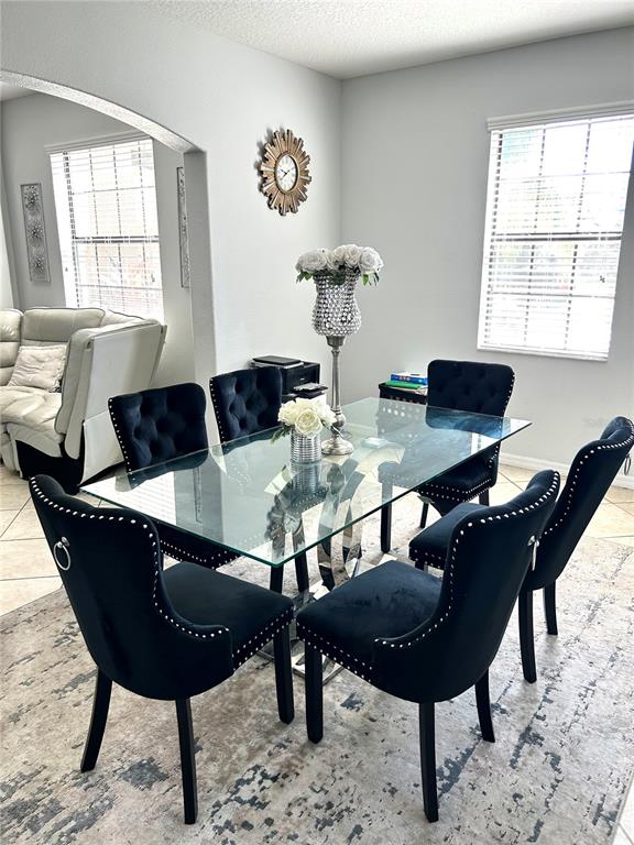13809 Felix Will Road Riverview, FL 33579 - Photo 15 of 75 a view of a dining room with furniture and window