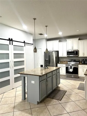 a view of entryway with kitchen