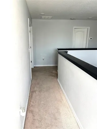 a bathroom with a bathtub and a picture of the wall