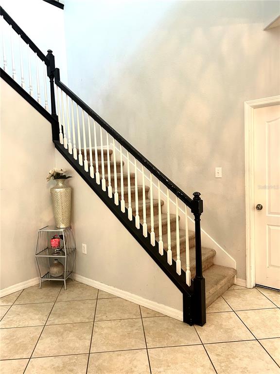 13809 Felix Will Road Riverview, FL 33579 - Photo 4 of 75 a view of entryway with wooden floor and stairs