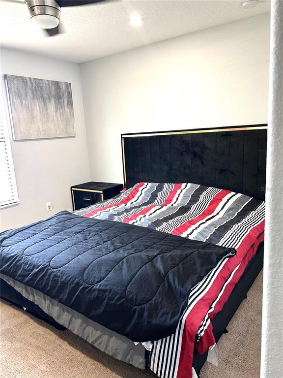 13809 Felix Will Road Riverview, FL 33579 - Photo 48 of 75 a bed sitting in a bedroom next to a window