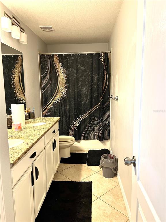 13809 Felix Will Road Riverview, FL 33579 - Photo 53 of 75 a bathroom with a sink and a mirror