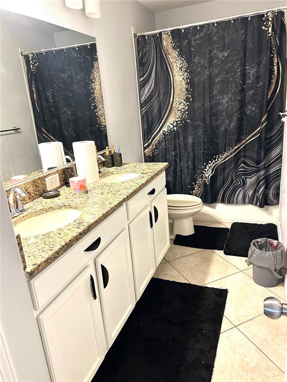 13809 Felix Will Road Riverview, FL 33579 - Photo 54 of 75 a bathroom with a granite countertop sink and a mirror