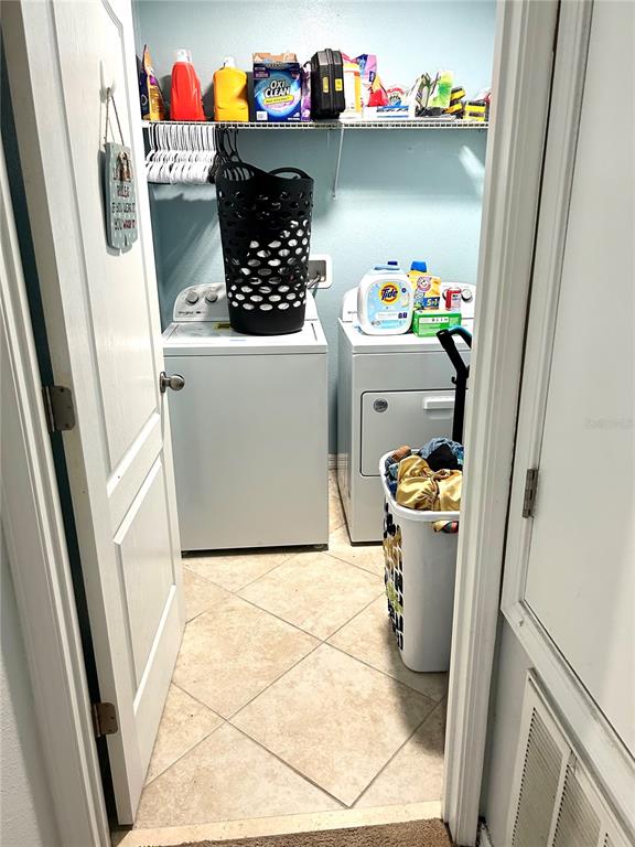 13809 Felix Will Road Riverview, FL 33579 - Photo 61 of 75 a utility room with dryer and washer