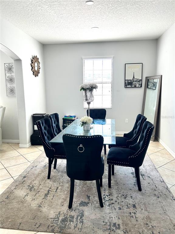 13809 Felix Will Road Riverview, FL 33579 - Photo 7 of 75 a view of a dining room with furniture