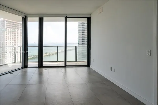 a view of an empty room with a window