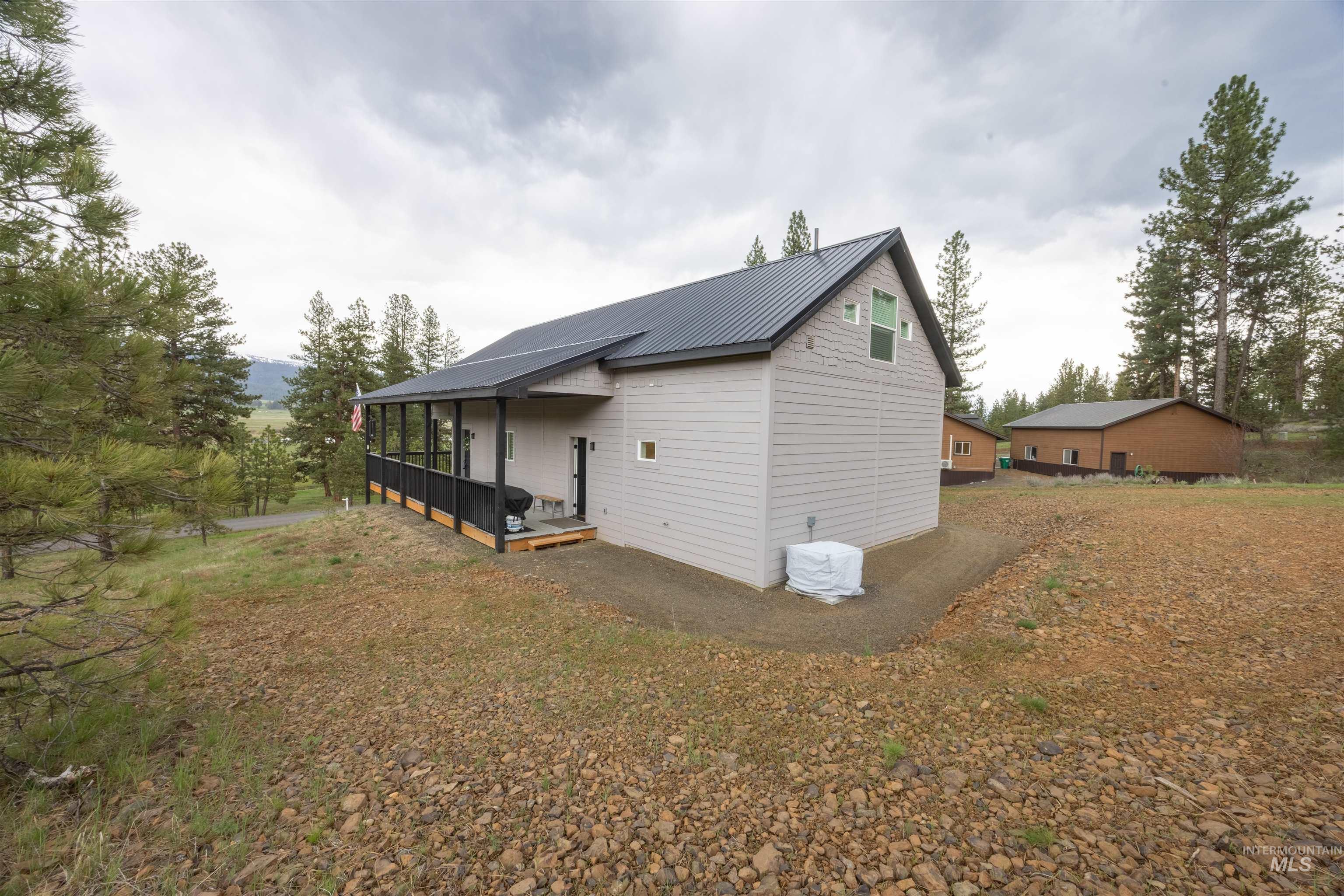 3873 Hot Springs Road New Meadows, ID 83654 - Photo 16 of 25 Contemporary residence featuring light gray siding and a dark metal roof