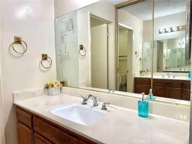 a bathroom with a sink double vanity and a mirror