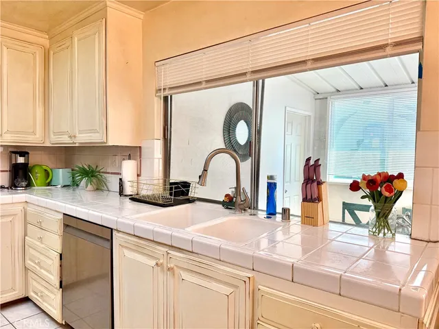 a kitchen with a sink and a window