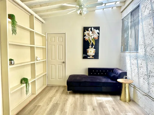 a view of a bedroom with furniture and a rug