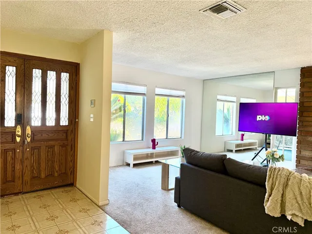 a living room with furniture and a window