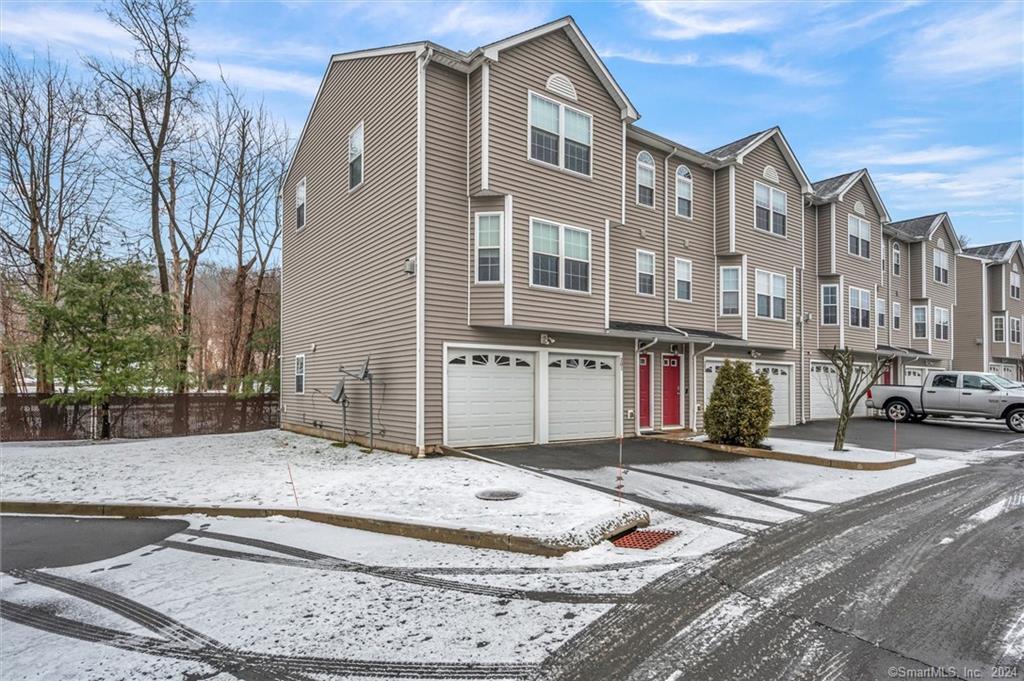 58 Leonard Street, Unit 201 Meriden, CT 06451 - Photo 1 of 1 a view of a building with many windows
