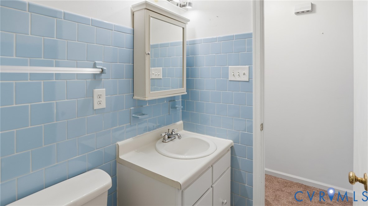 408 Springdale Avenue Colonial Heights, VA 23834 - Photo 29 of 49 Bathroom featuring tile walls, vanity, and carpet