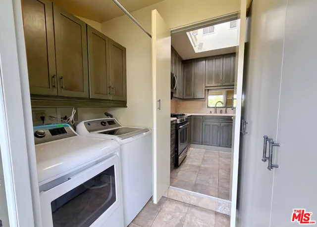 a kitchen with stainless steel appliances a refrigerator and a sink