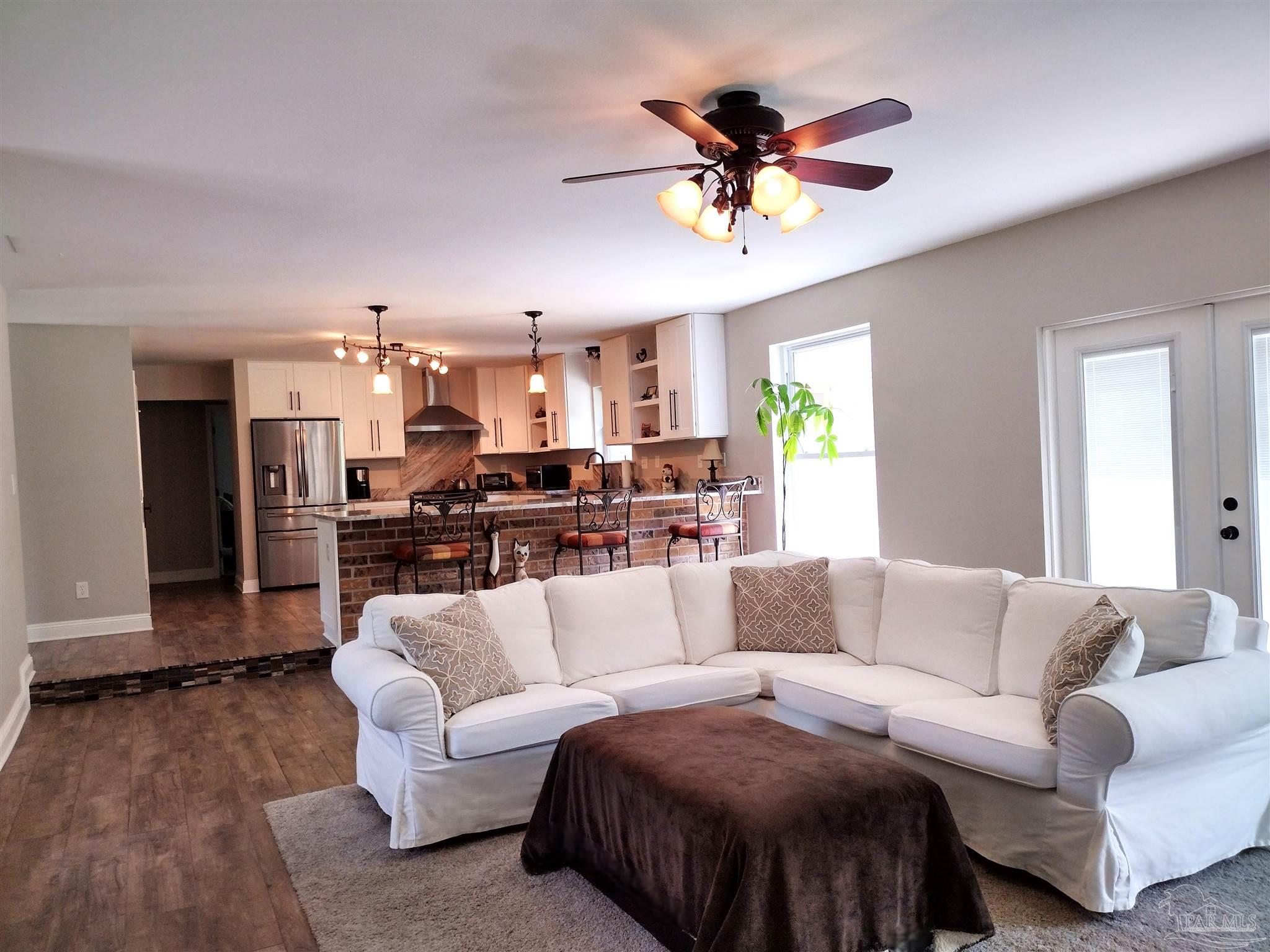 4611 Gunter Road Milton, FL 32570 - Photo 7 of 29 a living room with furniture and kitchen view