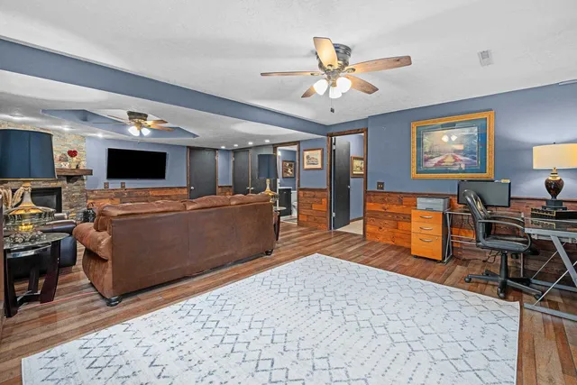 a living room with furniture and a flat screen tv
