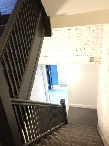 a view of balcony with wooden floor