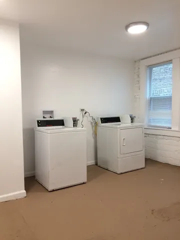 a utility room with washer and dryer