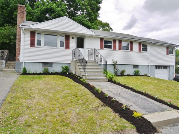 191 Hardy Pond Road Waltham, MA 02451 - Photo 1 of 16 a front view of a house with a yard