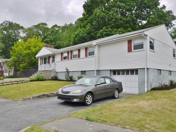 191 Hardy Pond Road Waltham, MA 02451 - Photo 16 of 16 a car parked in front of a house