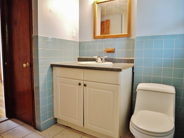 191 Hardy Pond Road Waltham, MA 02451 - Photo 6 of 16 a bathroom with a toilet a sink and mirror