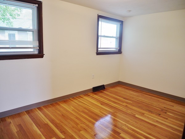 191 Hardy Pond Road Waltham, MA 02451 - Photo 8 of 16 a view of empty room with wooden floor and fan