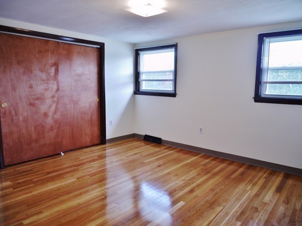 191 Hardy Pond Road Waltham, MA 02451 - Photo 9 of 16 wooden floor in an empty room with a window