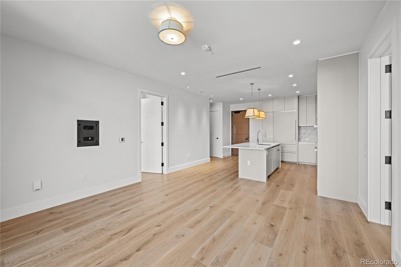 1901 Wazee Street, Unit 1110 Denver, CO 80202 - Photo 11 of 36 an empty room with wooden floor and windows