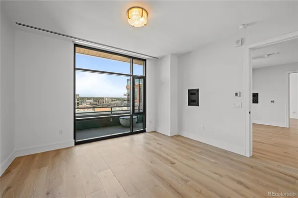 a view of a livingroom with wooden floor