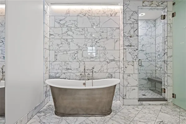 a white bath tub sitting in a bathroom