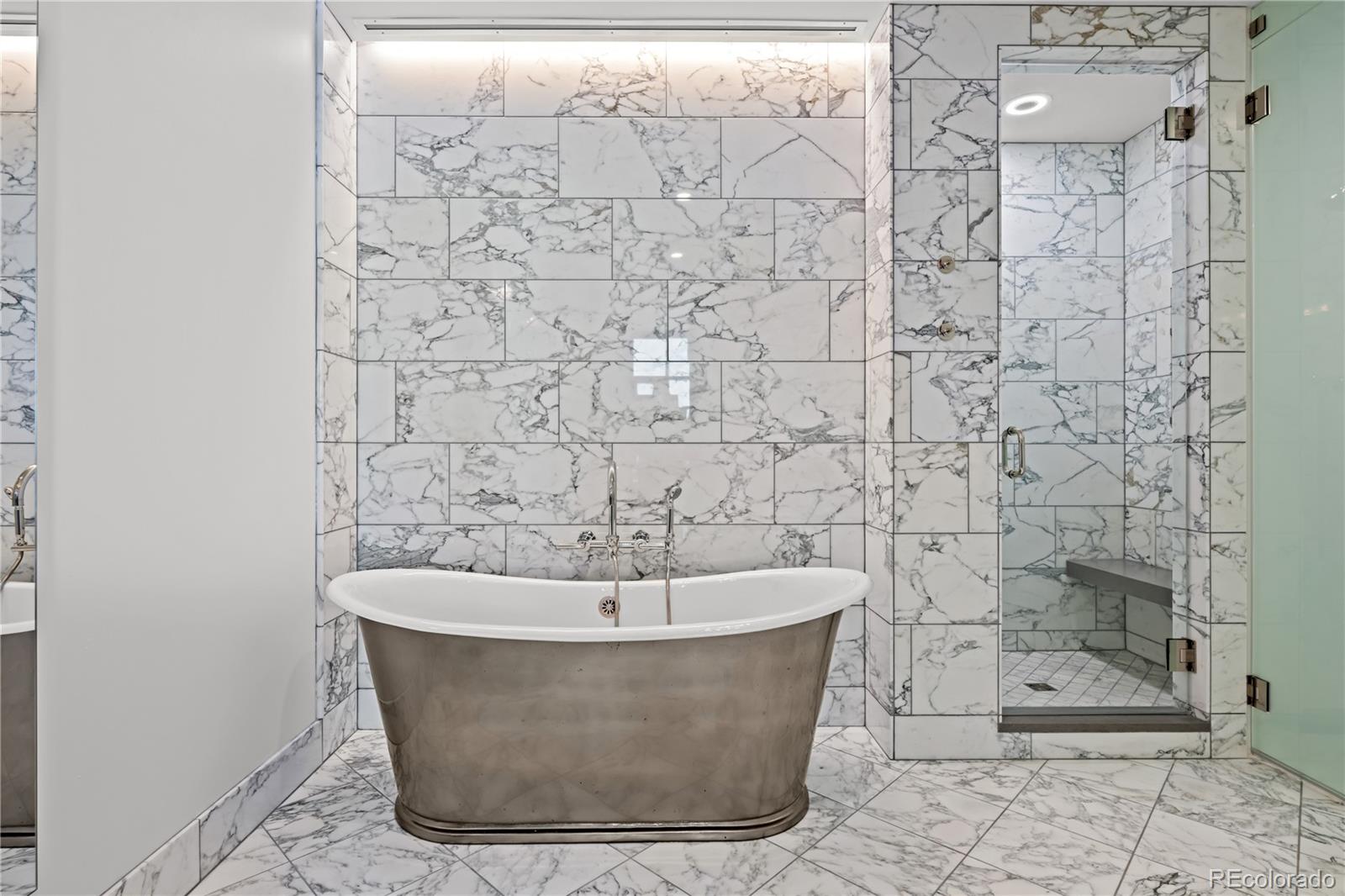 1901 Wazee Street, Unit 1110 Denver, CO 80202 - Photo 18 of 36 a white bath tub sitting in a bathroom