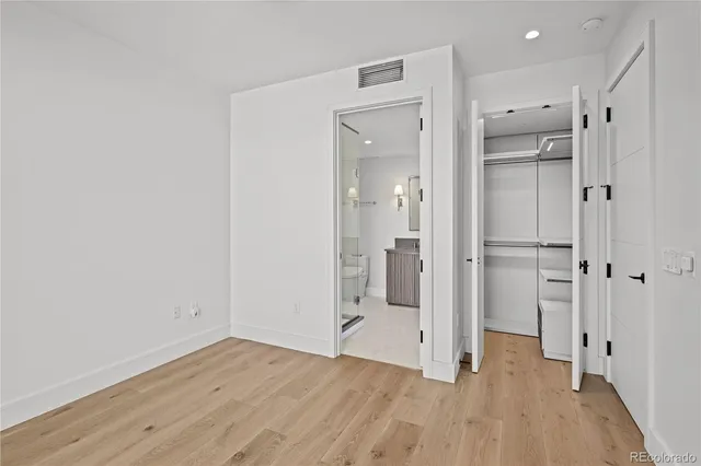 a view of a bathroom with a shower and a glass door