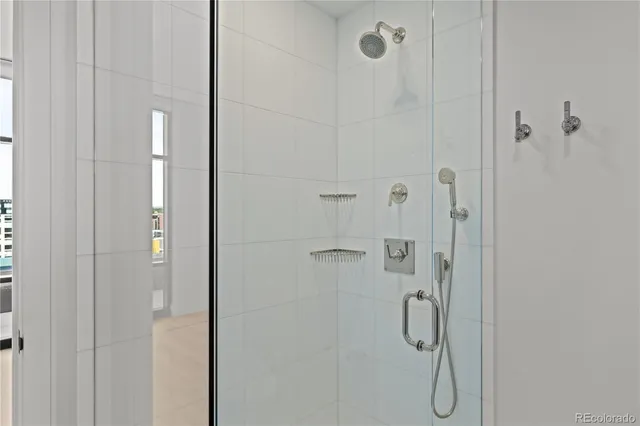 a bathroom with a glass shower door