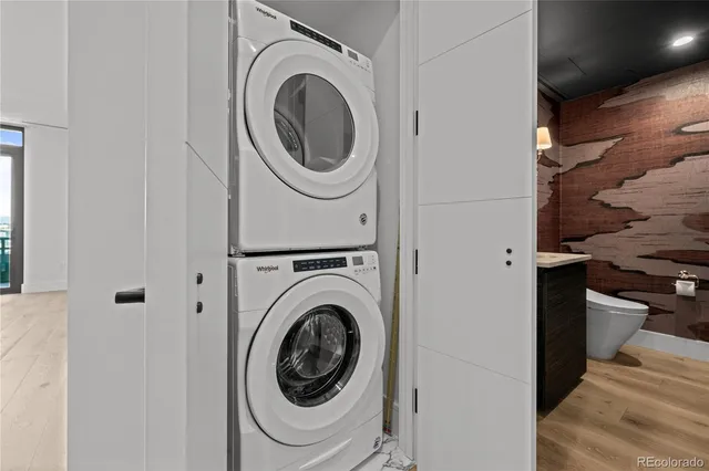 a view of a hallway with washer and dryer