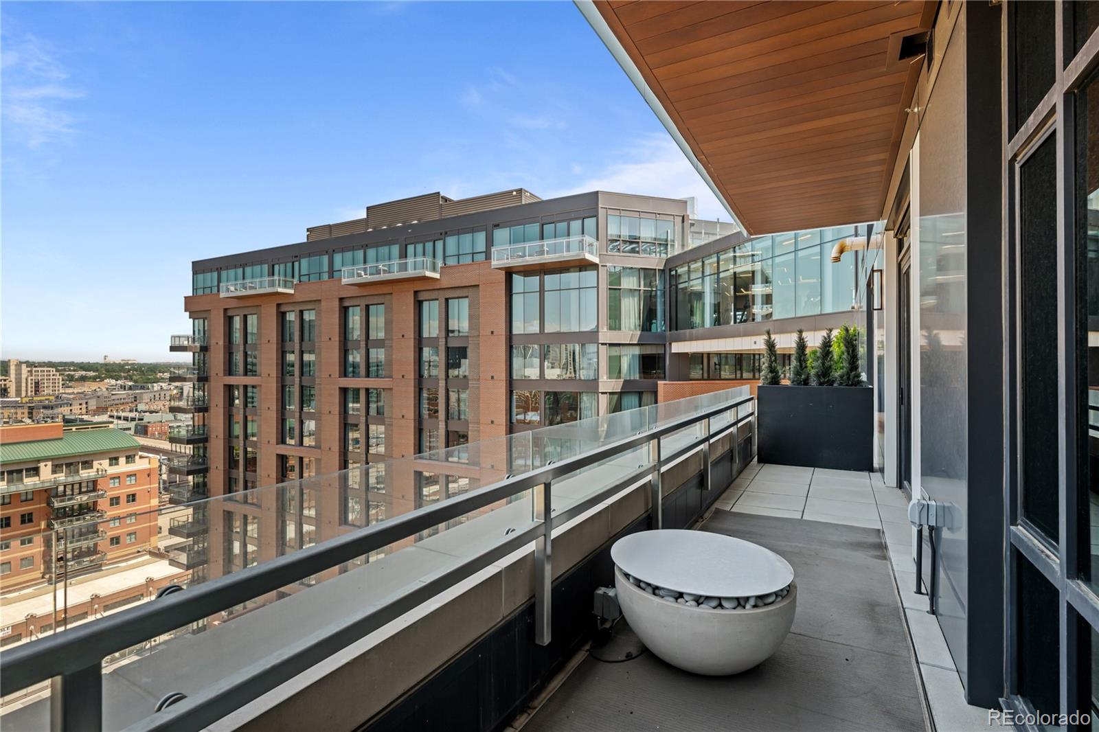 1901 Wazee Street, Unit 1110 Denver, CO 80202 - Photo 31 of 36 a bathroom with a toilet a sink and mirror