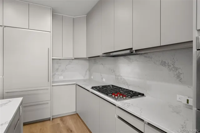 a kitchen with a sink and cabinets