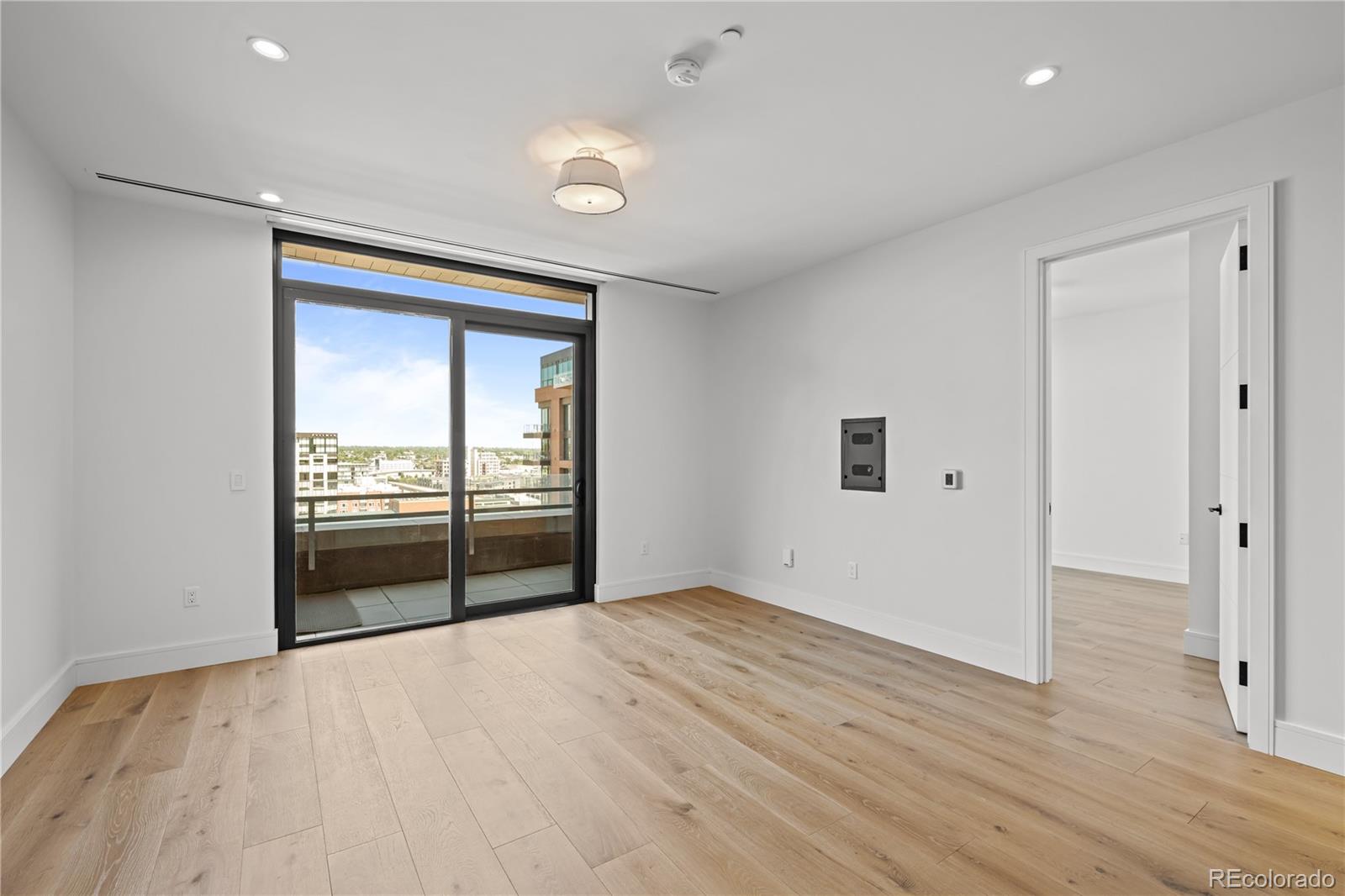 1901 Wazee Street, Unit 1110 Denver, CO 80202 - Photo 10 of 36 a view of empty room with wooden floor and fan