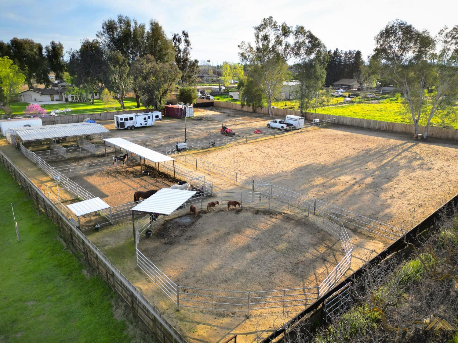 Undisclosed Address Bakersfield, CA 93314 - Photo 3 of 52 an aerial view of a house with swimming pool