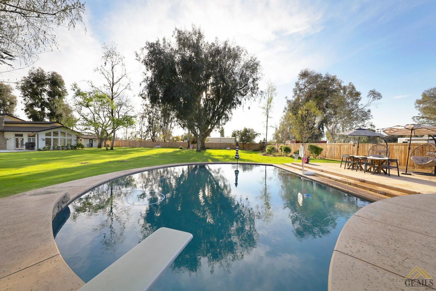 Undisclosed Address Bakersfield, CA 93314 - Photo 33 of 52 a view of swimming pool with a yard
