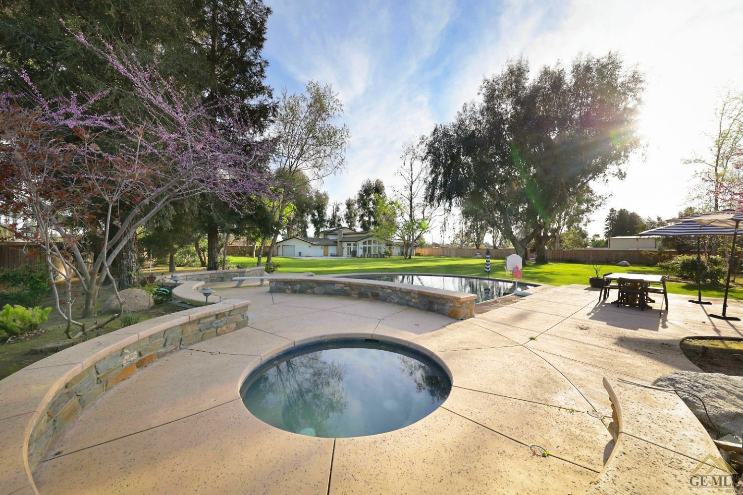 Undisclosed Address Bakersfield, CA 93314 - Photo 34 of 52 a view of outdoor space with swimming pool and seating