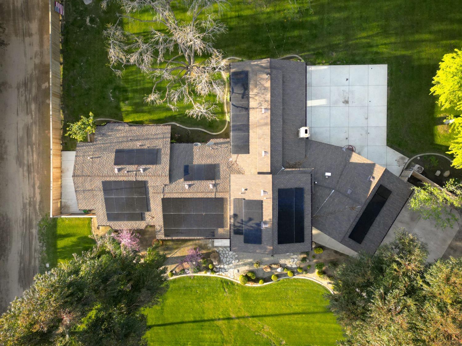 Undisclosed Address Bakersfield, CA 93314 - Photo 35 of 52 an aerial view of a house with outdoor space patio swimming pool and outdoor seating