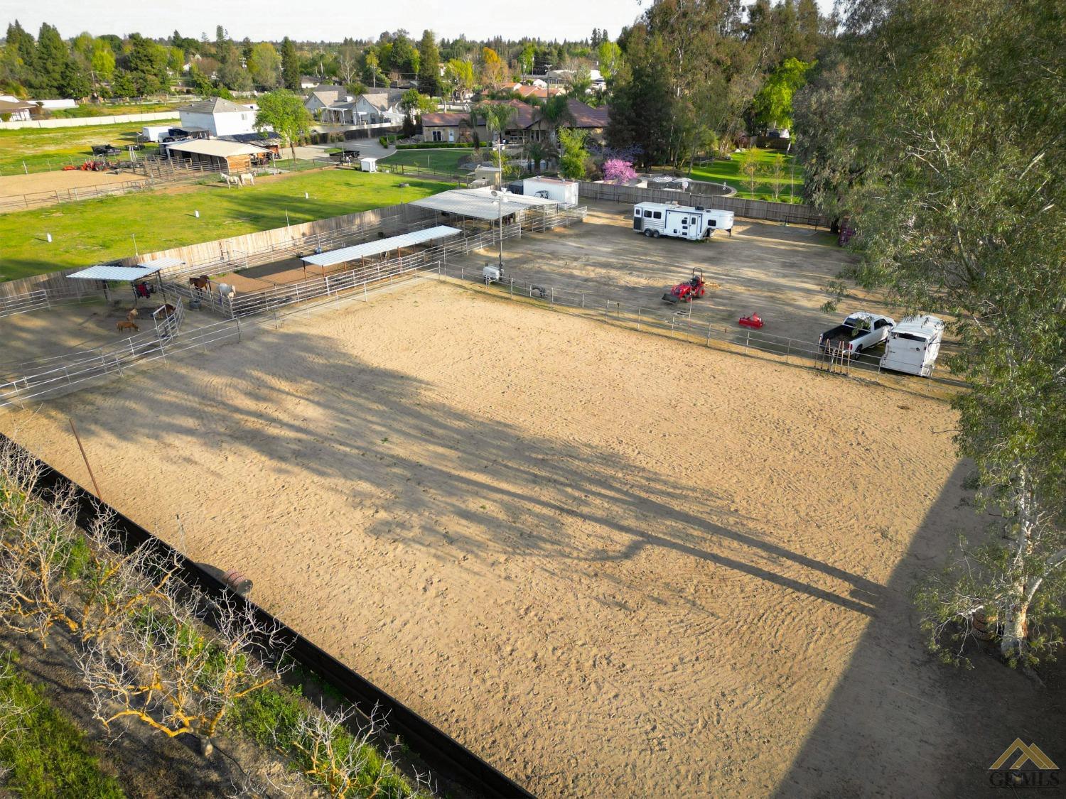 Undisclosed Address Bakersfield, CA 93314 - Photo 41 of 52 a view of swimming pool with lawn chairs and plants