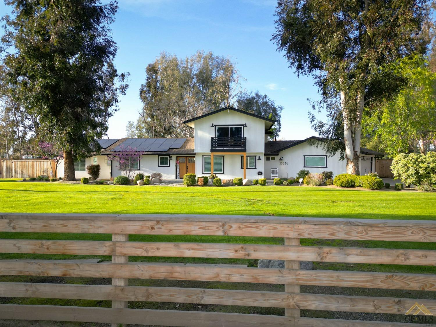 Undisclosed Address Bakersfield, CA 93314 - Photo 48 of 52 a front view of a house with a yard