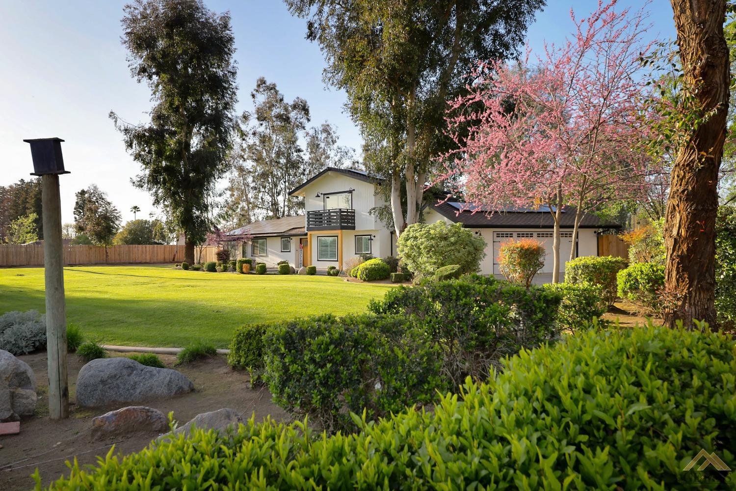 Undisclosed Address Bakersfield, CA 93314 - Photo 50 of 52 a front view of a house with garden