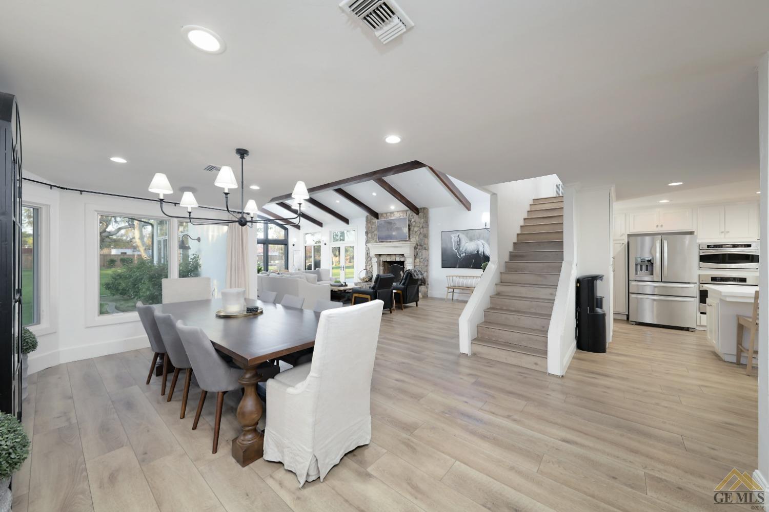 Undisclosed Address Bakersfield, CA 93314 - Photo 7 of 52 a view of a dining room with furniture and wooden floor