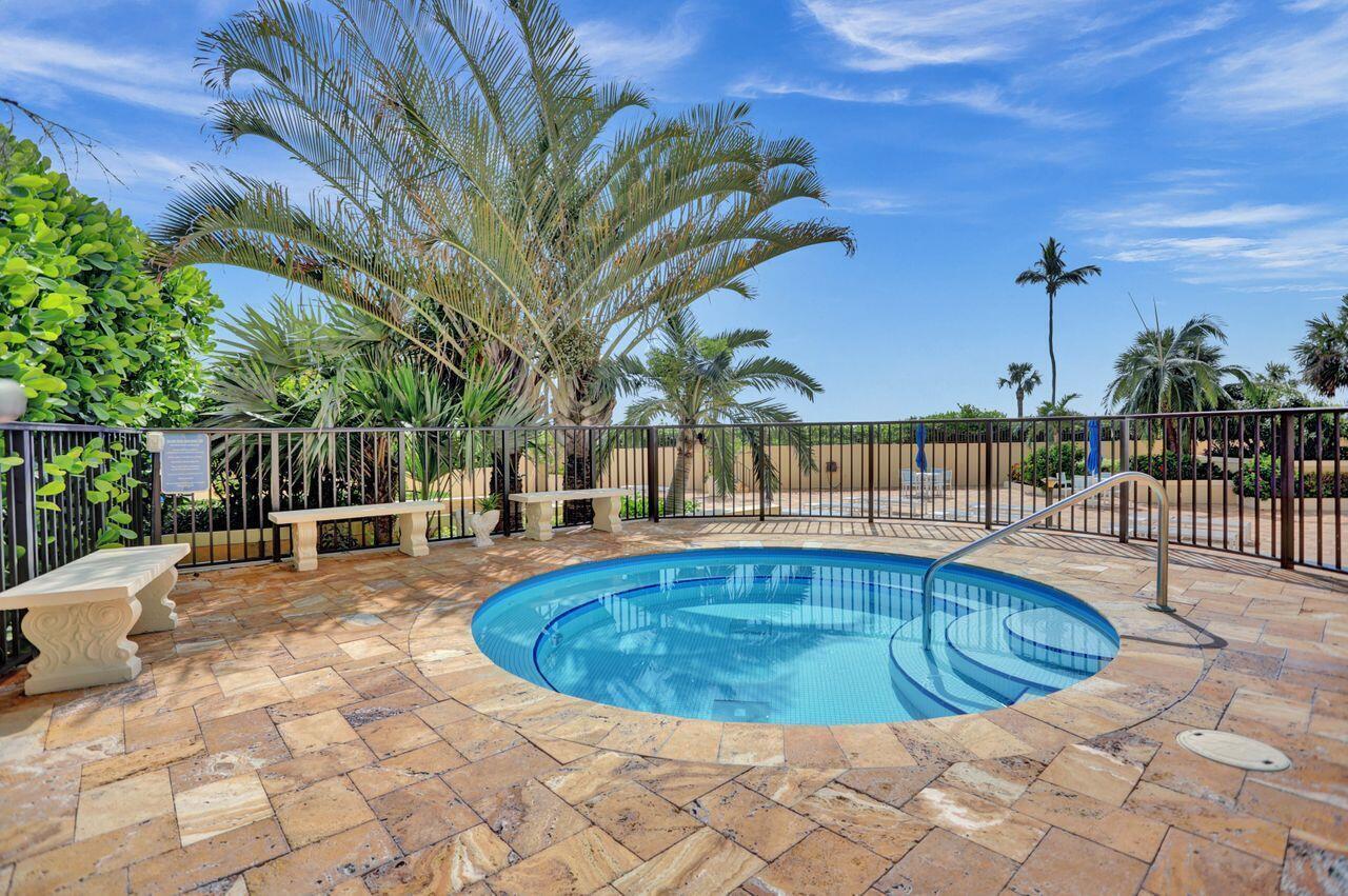 100 Ocean Trail Way, Unit 109 Jupiter, FL 33477 - Photo 17 of 27 a view of a swimming pool with a patio