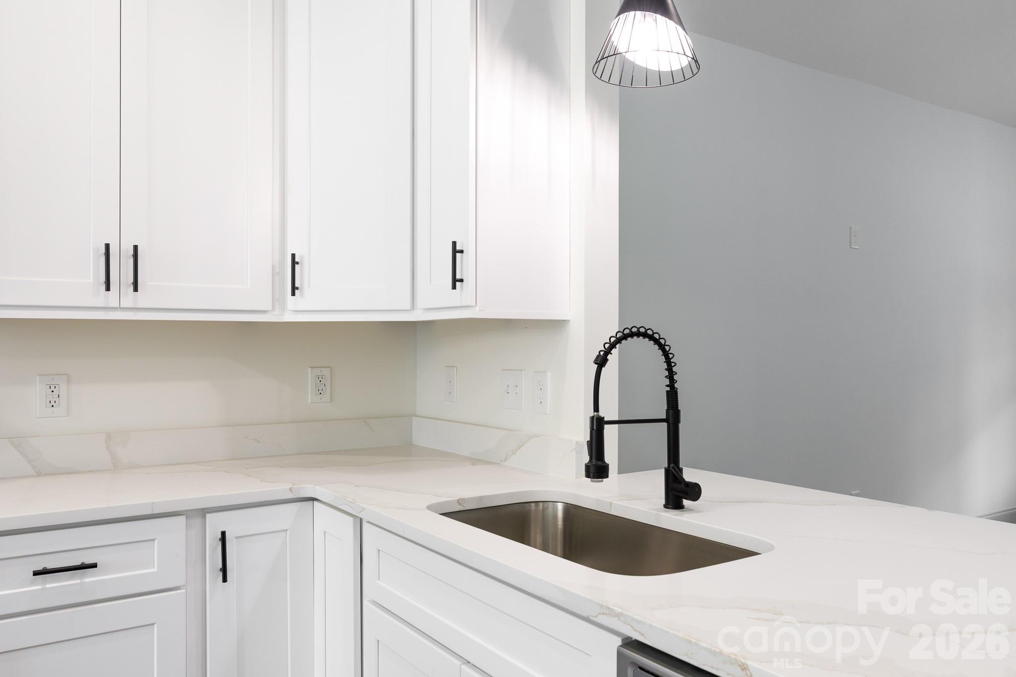 107 Brown Street, Unit 12 Clover, SC 29710 - Photo 12 of 33 a kitchen with a sink and cabinets