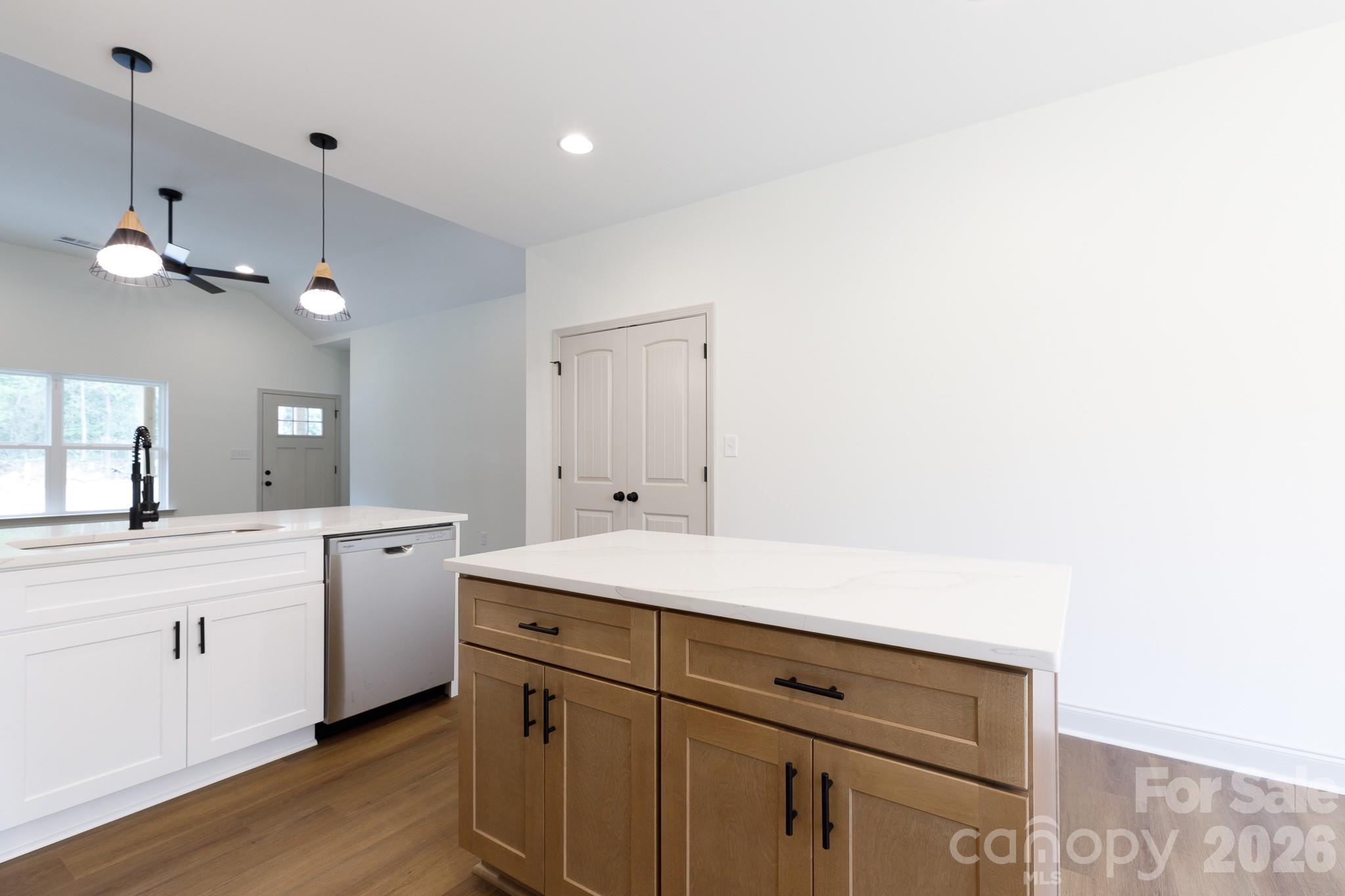 107 Brown Street, Unit 12 Clover, SC 29710 - Photo 14 of 33 a kitchen with a sink cabinets and wooden floor