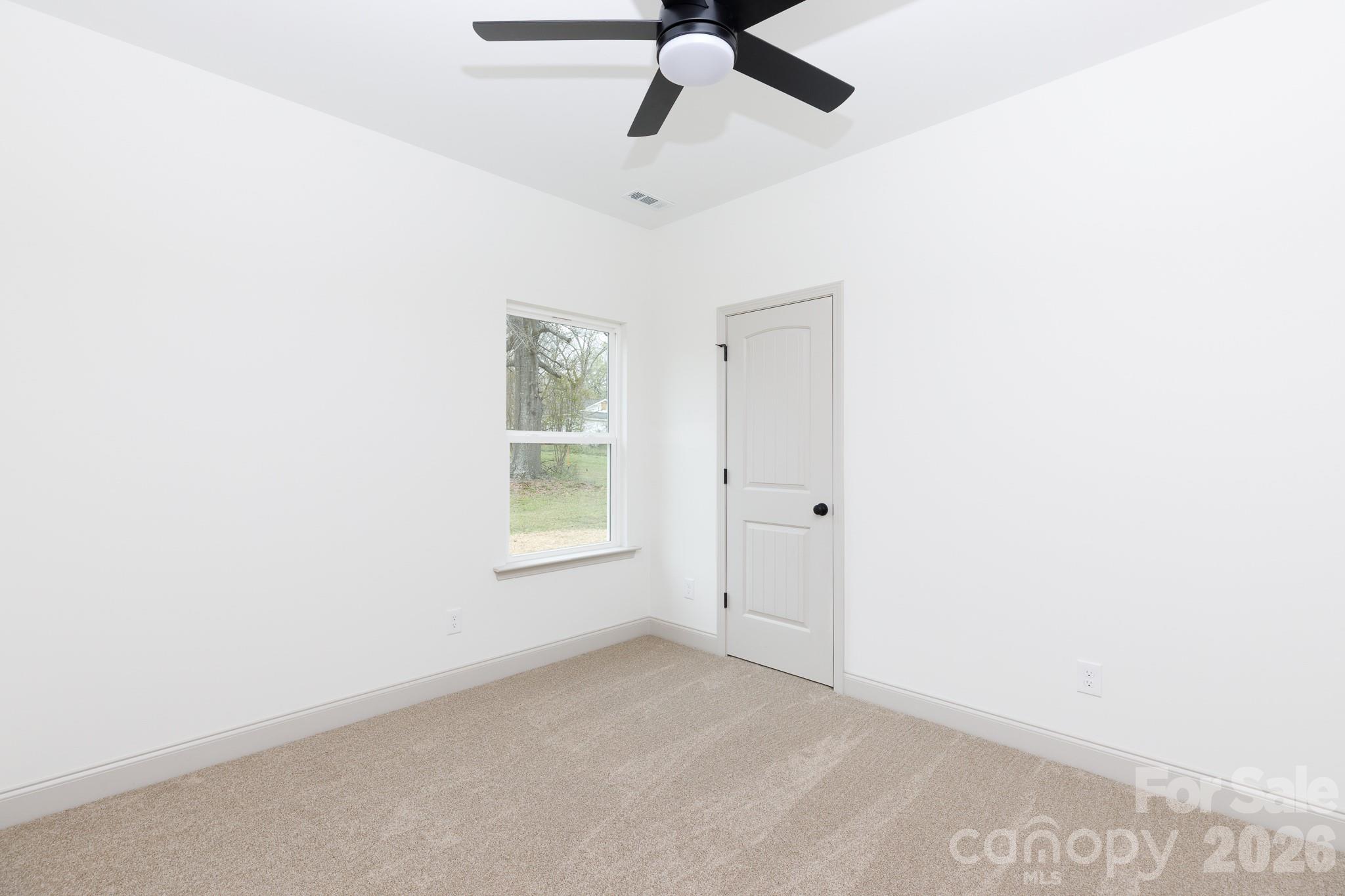 107 Brown Street, Unit 12 Clover, SC 29710 - Photo 28 of 33 a view of an empty room with a window